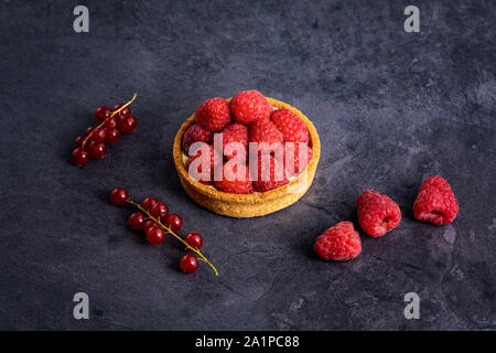 raspberry pie on black stone background Stock Photo