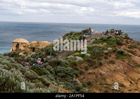 Visitors viewing the Twelve Apostles from a high vantage point in the Campbell National Park in Victoria, Australia Stock Photo