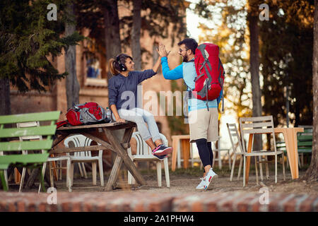 smiling couple preparing to continue travelling Stock Photo