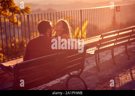Young loving couple enjoys at the sunset Stock Photo