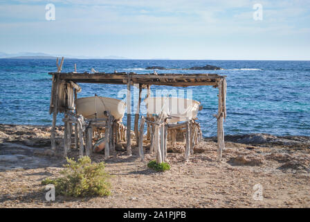 Boats in a shelter on Formentera's coast overlooking the bay. Stock Photo