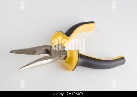 pliers with a long working part and dielectric handles are isolated on a white background Stock Photo