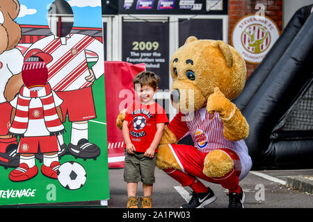 Stevenage, UK. 28th Sep, 2019. Craig Mackail-Smith of Stevenage FC's son catches a moment with the team mascot before the EFL Sky Bet League 2 match between Stevenage and Cambridge United at the Lamex Stadium, Stevenage, England on 28 September 2019. Photo by Phil Hutchinson. Editorial use only, license required for commercial use. No use in betting, games or a single club/league/player publications. Credit: UK Sports Pics Ltd/Alamy Live News Stock Photo