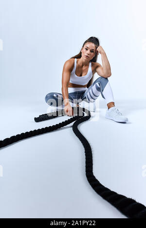pensive thoughtful serious exhausted woman resting after difficult training. sportswoman posing to the camera Stock Photo