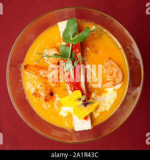 Pumpkin soup in martini glass shot from above Stock Photo