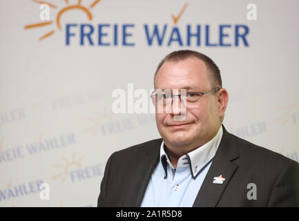 Rostock, Germany. 28th Sep, 2019. Deputy state chairman Rene Eichhorn (Free Voters of Mecklenburg-Western Pomerania) will stand in front of the party logo in the conference hall of the Trihotel after his election. At the state party conference, the free voters of Mecklenburg-Western Pomerania elected their new executive committee. Credit: Danny Gohlke/dpa/Alamy Live News Stock Photo