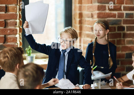 stress, fail concept.angry busineeman holding documents in hands, scolding his employees, close up photo Stock Photo