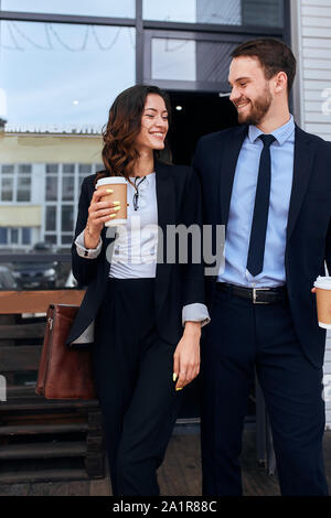 two awesome colleagues laughing, flirting, enjoying time, having fun after working day. close up photo. happiness Stock Photo