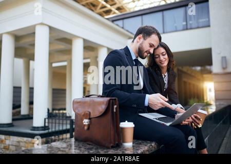 two good looking man and woman discussing presentation, brainstorming. close up side view photo Stock Photo