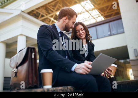 happy young people doing shopping online, choosing furniture, house, flat, close up side view photo, people concept Stock Photo