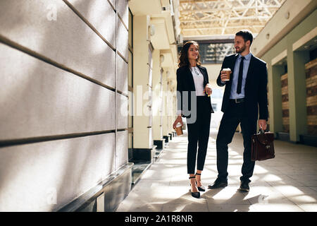 good looking young business people sharing with emotions after meeting. full length photo. copy space Stock Photo