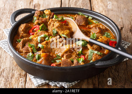 Asian cuisine traditional Lamb rogan josh with spices and gravy close-up in a pan on the table. horizontal Stock Photo