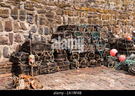 Lobster pots at Clovelly harbour on the north Devon coast Stock Photo