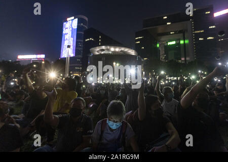 Hong Kong, China. 28th Sep, 2019. Thousands of pro democracy protesters gathered in Hong Kong's Tamar park to attend the Anti Authoritarianism Rally on the 5th anniversary of the start of the Yellow Umbrella Revolution. After the rally thousands of protesters approched the Cnetral Government Complex and began throwing stones and molotov cocktails at the barriers surrounding the complex. Hong Kong police deployed a water cannon vehicle and riot police to disperse the protesters. Credit: Adryel Talamantes/ZUMA Wire/Alamy Live News Stock Photo