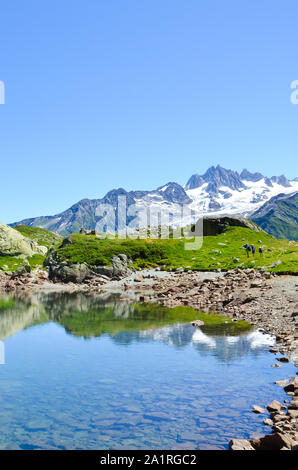 Stunning Lac de Cheserys, Lake Cheserys near Chamonix-Mont-Blanc in French Alps. Alpine lake with snow capped mountains in the background. France Alps, Tour du Mont Blanc trail. Nature background. Stock Photo