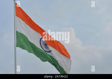 Indian National Flag, the tricolor fluttering and unfurling in the Central Park at Connaught Place, Delhi, India. Stock Photo