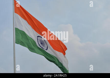 Indian National Flag, the tricolor fluttering and unfurling in the Central Park at Connaught Place, Delhi, India. Stock Photo