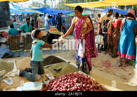 Farmers and sellers with their products on the stalls on market day in Missamari, Assam State, India Stock Photo