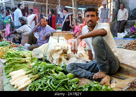 Farmers and sellers with their products on the stalls on market day in Missamari, Assam State, India Stock Photo