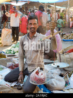 Farmers and sellers with their products on the stalls on market day in Missamari, Assam State, India Stock Photo