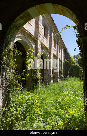 Overgrown cloister at the ruin of the Monastery of Santa María la Real de Obona along the Camino Primitivo. After visiting, King Alfonso IX designated Stock Photo