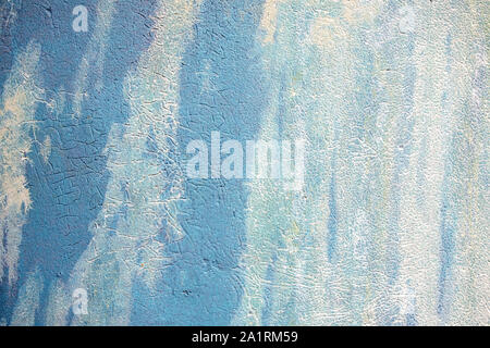 close up of faded blue and white streaked paint texture Stock Photo