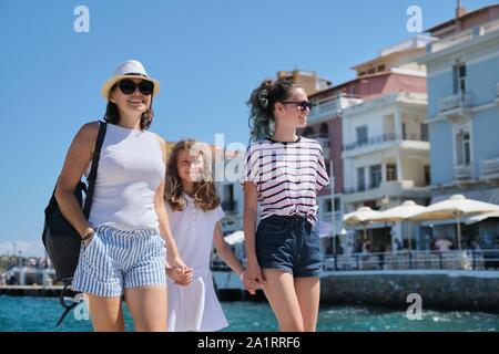Mother with children Mediterranean summer sea holidays. Europe tourist travel cruise vacation, Greece Mirabello Bay, Agios Nikolaos Stock Photo