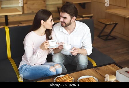 Young millennial couple amorously looking at each other Stock Photo