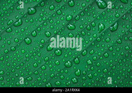 Water drops on banana leaf background Stock Photo