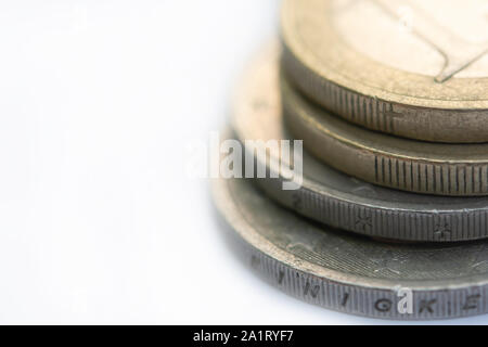 Close up Stack of coins on white background with copy space Stock Photo