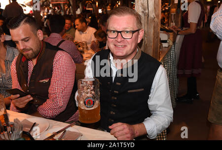 Munich, Germany. 28th Sep, 2019. Florian Hoeneß celebrates in the beetle tent. The largest folk festival in the world lasts until 6 October. Credit: Felix Hörhager/dpa/Alamy Live News Stock Photo