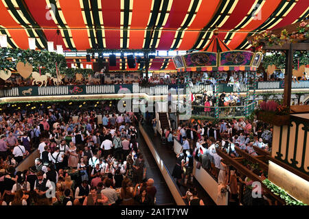 Munich, Germany. 28th Sep, 2019. Guests celebrate in the Marstall marquee on the Wiesn. The largest folk festival in the world lasts until 6 October. Credit: Felix Hörhager/dpa/Alamy Live News Stock Photo