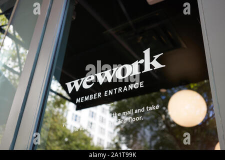 Portland, Oregon, USA - Sep 6, 2019: The WeWork logo at the entrance to a WeWork co-working space location in Pioneer Place in downtown Portland. Stock Photo