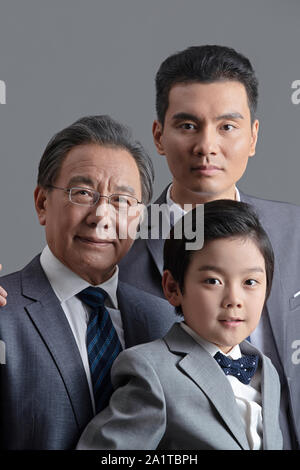 Three people between the two generations Stock Photo