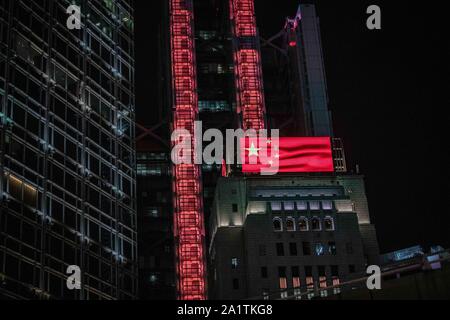 Hong Kong, China. 28th Sep, 2019. A view of a Screen on top of building at Central Financial Centre celebrating the 70th anniversary of People's Republic of China during a rallyDemonstrations continue in Hong Kong in another night of protests during the commemoration of the 5th anniversary of the Umbrella Movement at Tamar Park. Credit: SOPA Images Limited/Alamy Live News Stock Photo