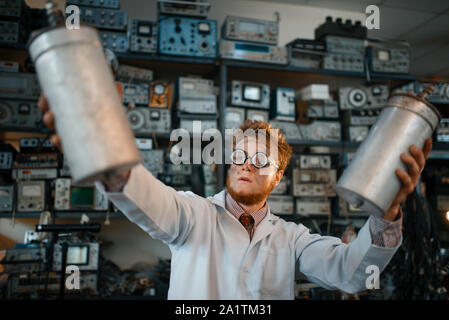 Scientist holds radiation devices in his hands Stock Photo