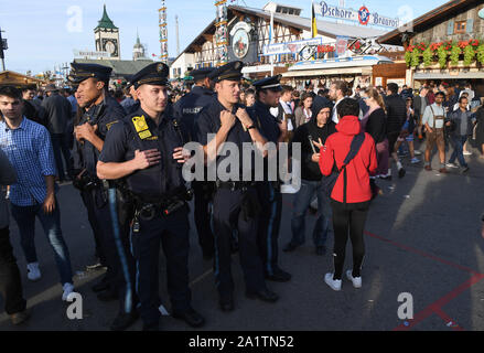 Munich, Germany. 28th Sep, 2019. Policemen are standing in the Wirtsbudenstraße on the Wiesn. The largest folk festival in the world lasts until 6 October. Credit: Felix Hörhager/dpa/Alamy Live News Stock Photo