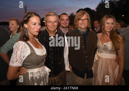 Munich, Germany. 28th Sep, 2019. Caroline Bosbach (l-r), lawyer Wolfgang Bosbach, media manager Martin Krug and his girlfriend Martina Nicia celebrate in the Käfer tent. The largest folk festival in the world lasts until 6 October. Credit: Felix Hörhager/dpa/Alamy Live News Stock Photo