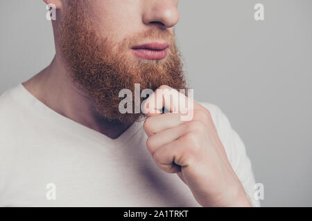 Close up cropped portrait photo of half turn face man touch bear Stock Photo