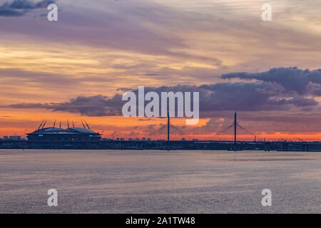 Krestovsky island, Gazprom Arena, and Western high speed diameter (toll road) at dawn viewed fron the deck of P&O Arcadia, St Peterburg, Russia. Stock Photo