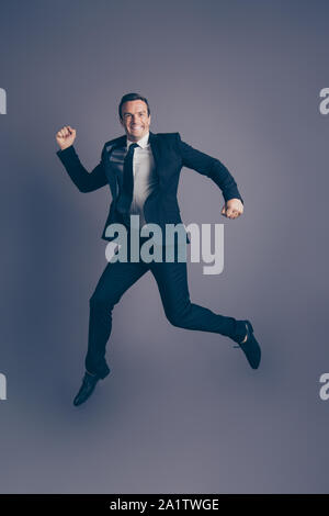 Vertical full length size photo studio portrait of humorous comi Stock Photo