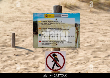 Mallorca, Spain, August 16 2019: sign prohibiting access to the regeneration sand dune reserve, Cala Mesquida beach Majorca Spain Stock Photo
