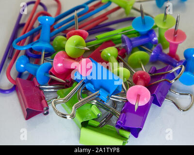 Colorful paper clips on white background Stock Photo