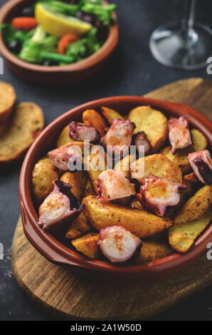 Galician-style octopus with boiled potatoes dusted in smoked paprika ...