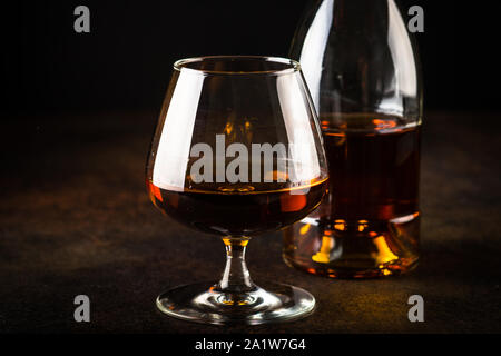 Cognac or brandy in the glass. Stock Photo