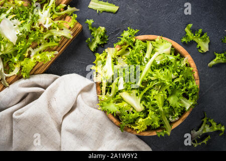 Green salad frieze on black background. Stock Photo