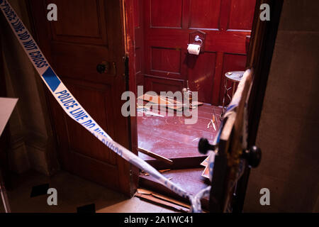 Crime scene. The broken door and floor inside Blenheim Palace where the theft of Maurizio Cattelan's 18 carat Golden toilet art exhibition took place. Stock Photo