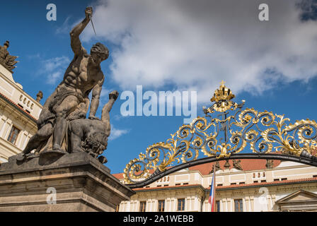 Prague Castle, Hradcany, Prague, Czech Republic. Large 18th century wrestling Titan statues adorn the castle main entrance (also known as Giants Gate). Stock Photo