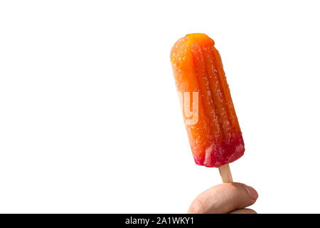 Juicy popsicles on a stick in a hand on a white background Stock Photo