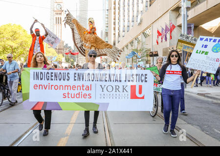 TORONTO, ONTARIO, CANADA - SEPTEMBER 27, 2019:  'Fridays for Future' climate change protest. Thousands of people march with signs at Global Climate St Stock Photo